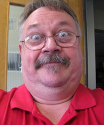 Bill holding camera.