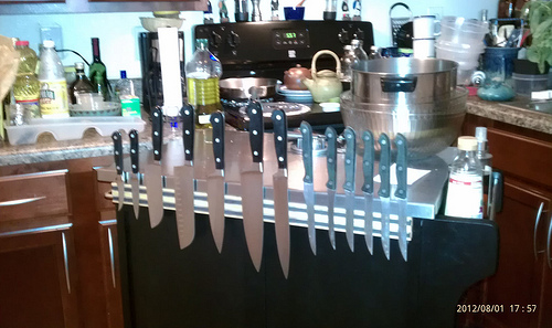 Knives on the magnetic holder on the island, from the back.