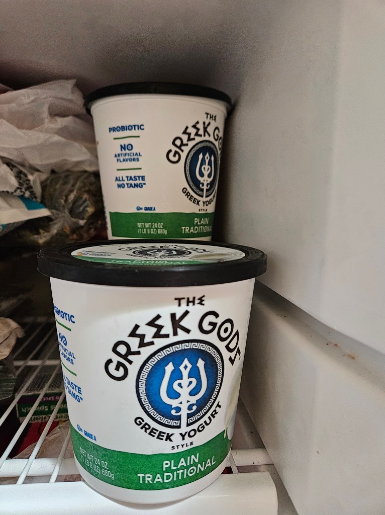 broth in yogurt containers in freezer